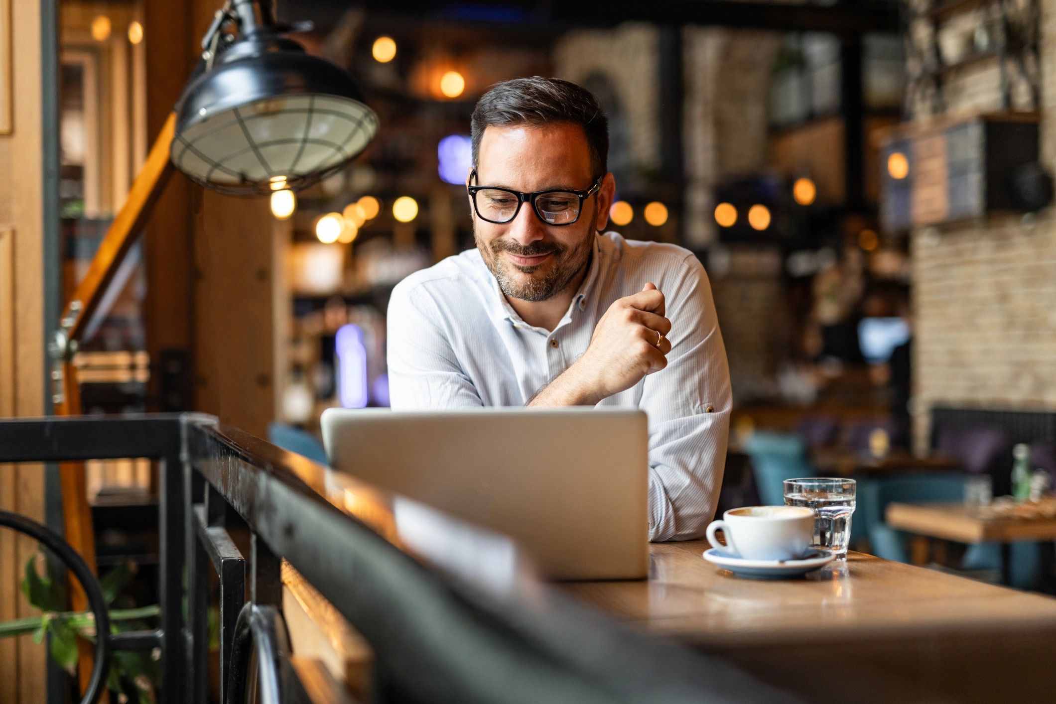 Person attending an online meeting on a laptop
