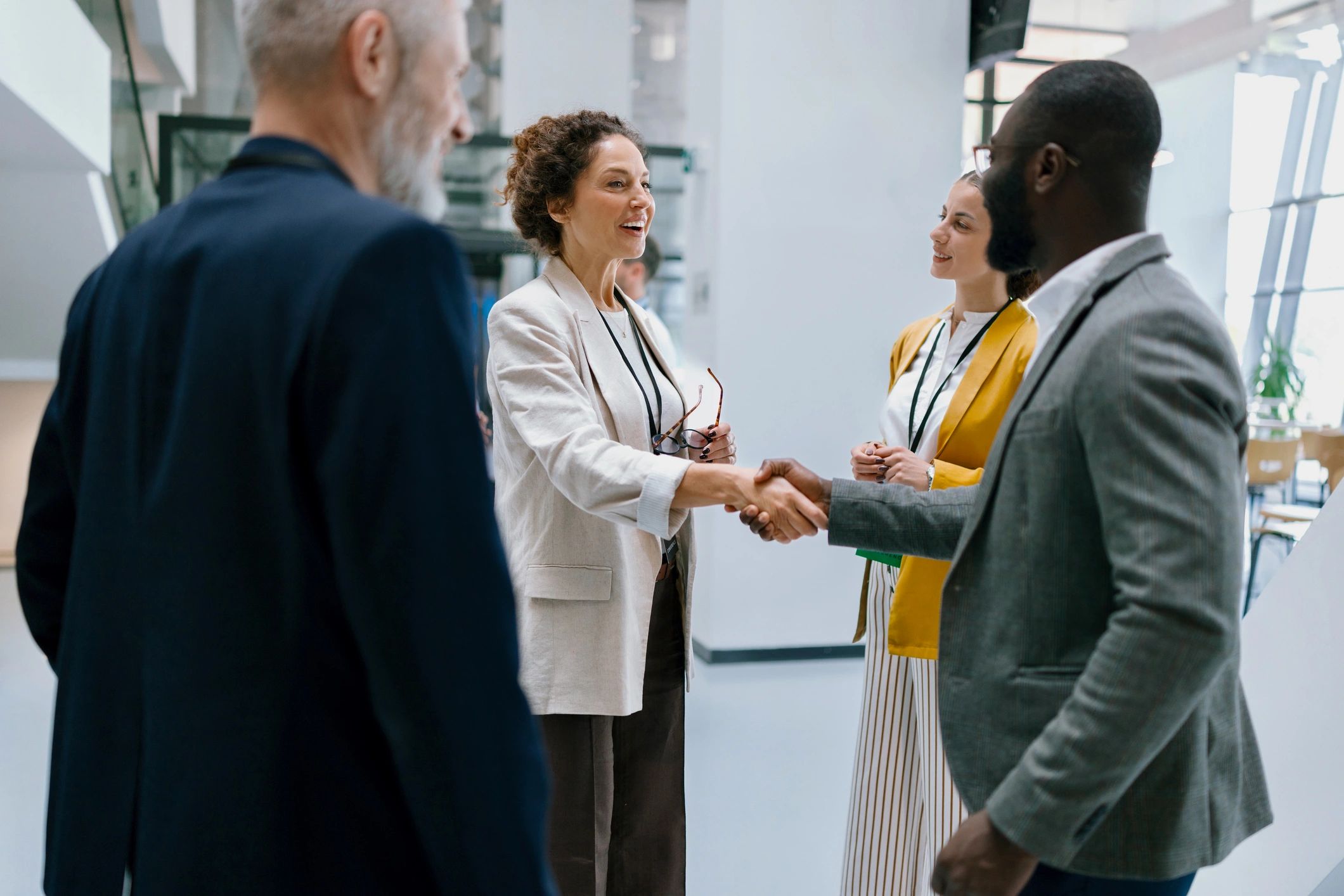 People greeting at a professional community event